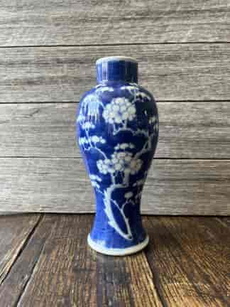 Chinese porcelain vase, blue ground with white prunus blossom 19th c