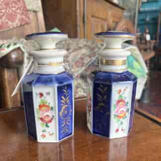 Pair of blue and white decanters painted with flowers