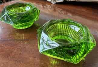 Pair of pressed green glass open salts, circa 1900