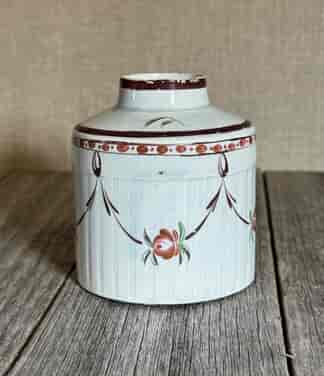 Creamware tea canister, engine turned with flower swags, c. 1790