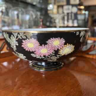 Japanese eggshell porcelain bowl, black with bright flowers, c. 1900