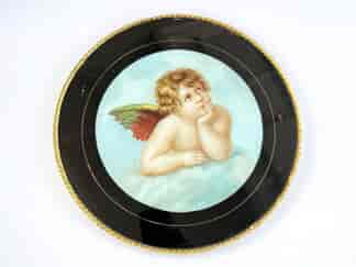 Victorian round glass hanging with reverse-painted + printed cherub, c. 1890