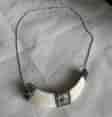 Indo- Tibetan boar tusk pendant with silver mounts, earlier 20th c.