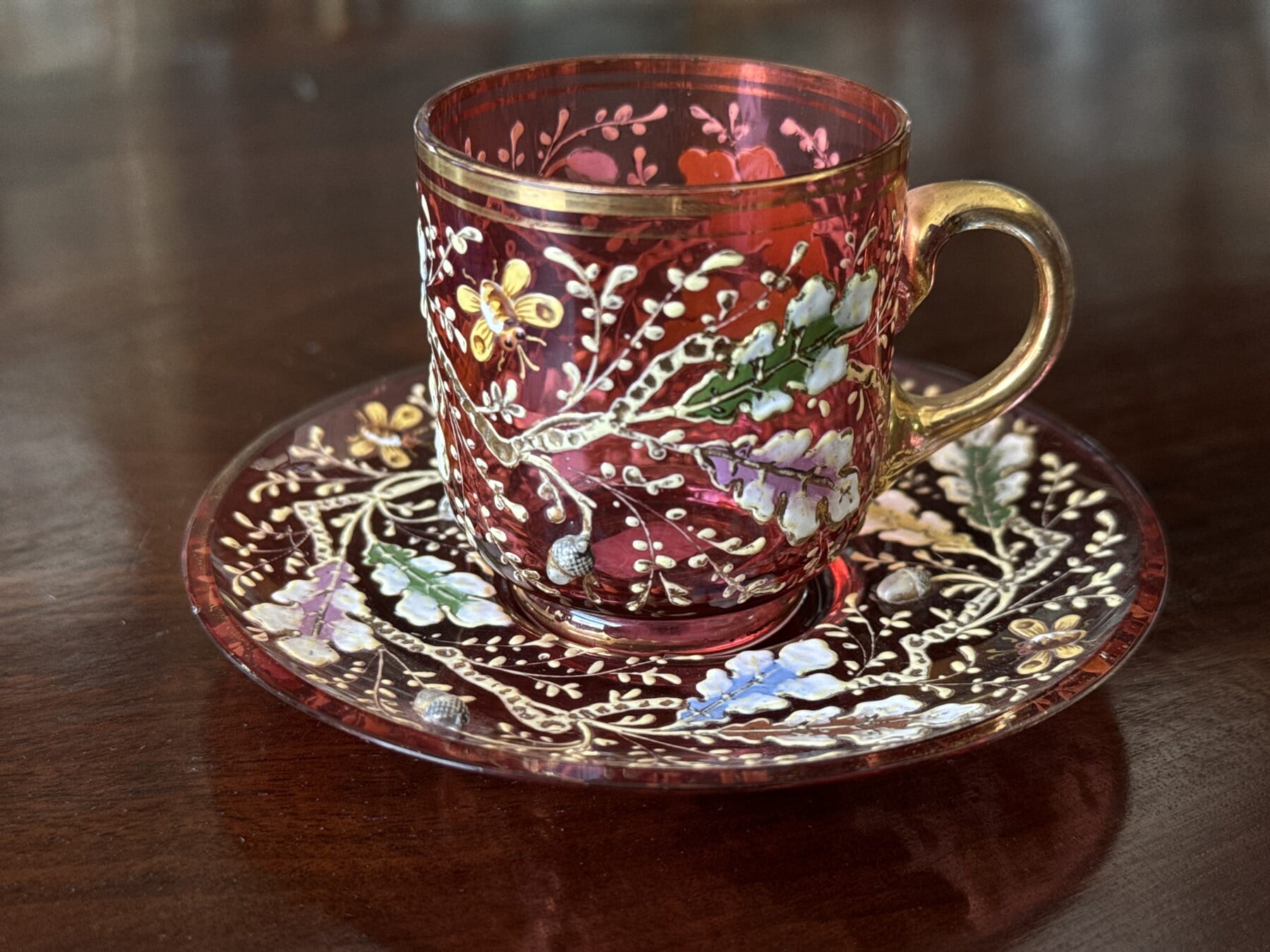 Moser ruby glass  cup + saucer, raised enamelled acorns & bees, c. 1885