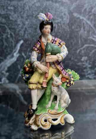 Derby figure of a piping shepherd + dog, c. 1785