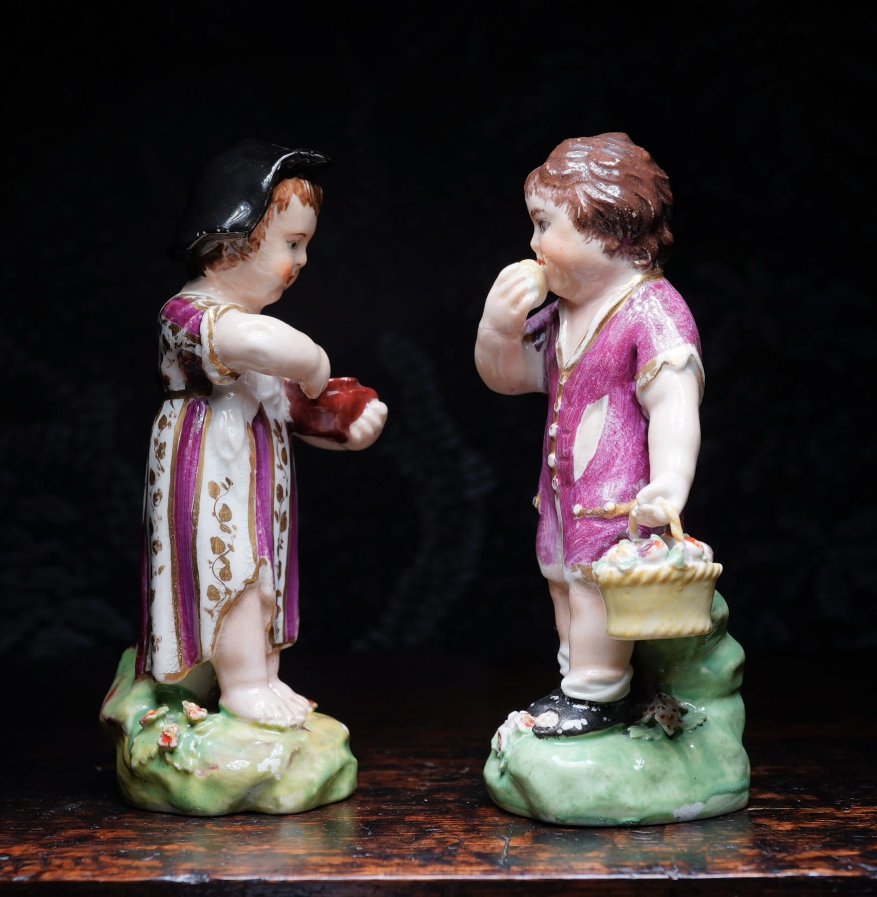Pair of Derby figures of children -'Boy eating apple, Girl eating curds-and-whey' c.1785