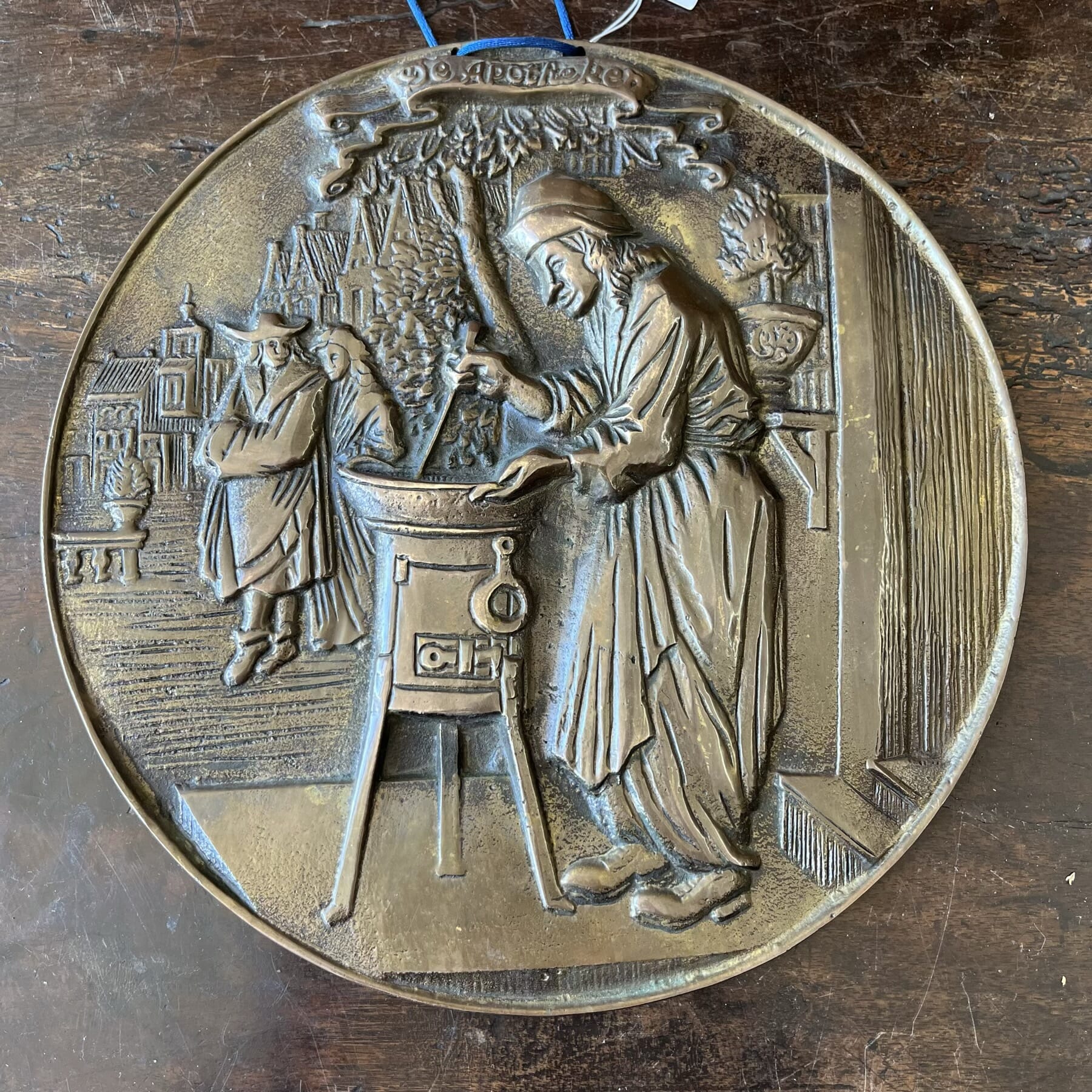 Bronze plaque, relief scene 'De Apocheker', after 17th c original by Jan Luyken, earlier 20th c.