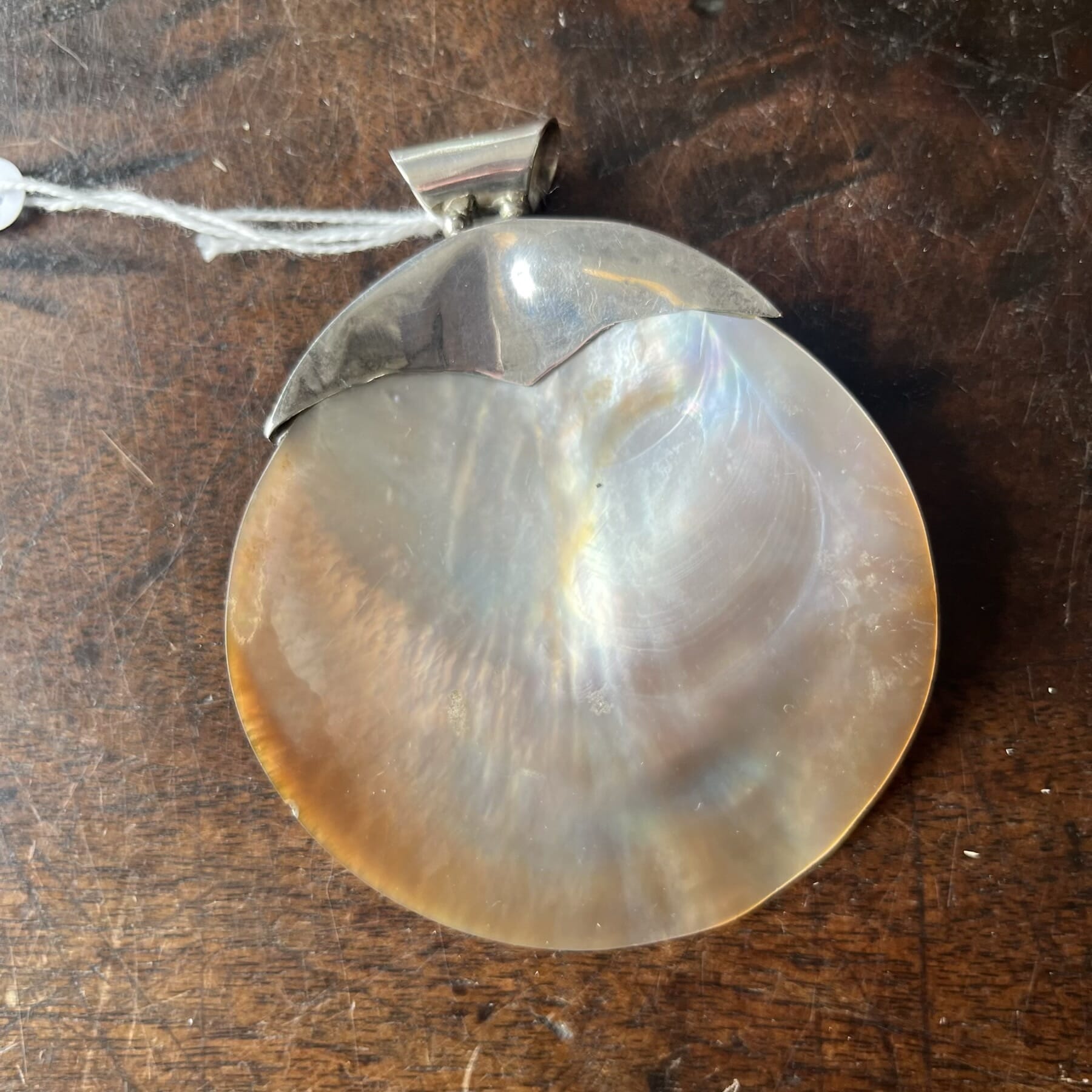 Large pearlshell pendant with silver mount, 20th C