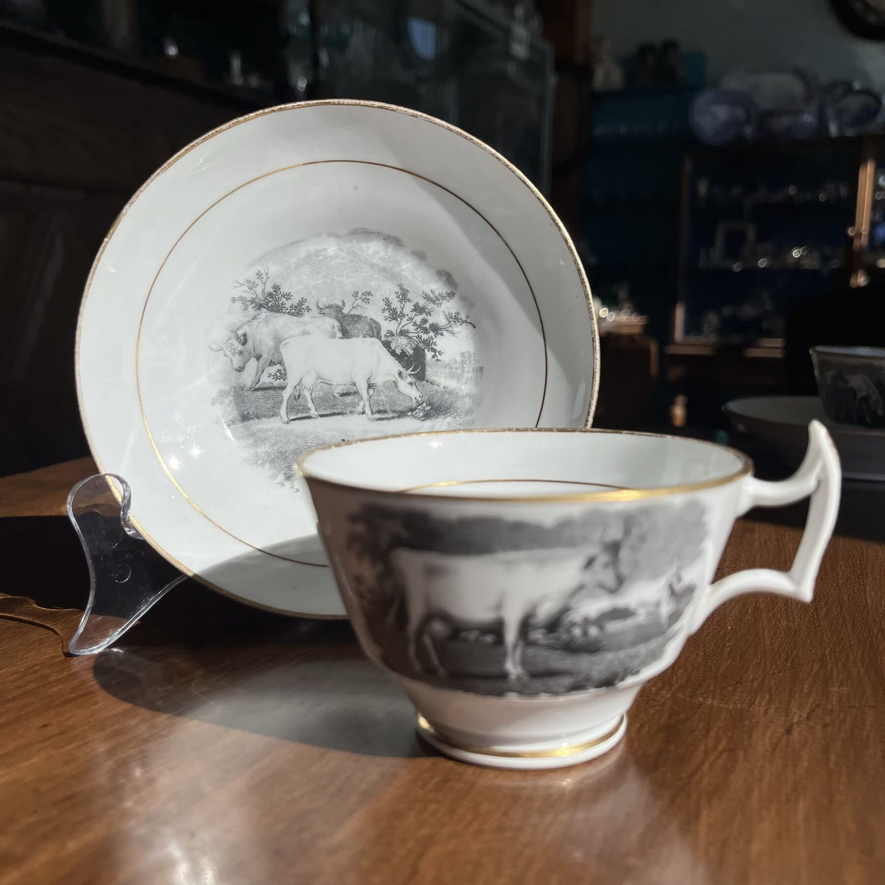 Newhall cup & saucer with black bat print of cattle, horses & deer, c. 1820