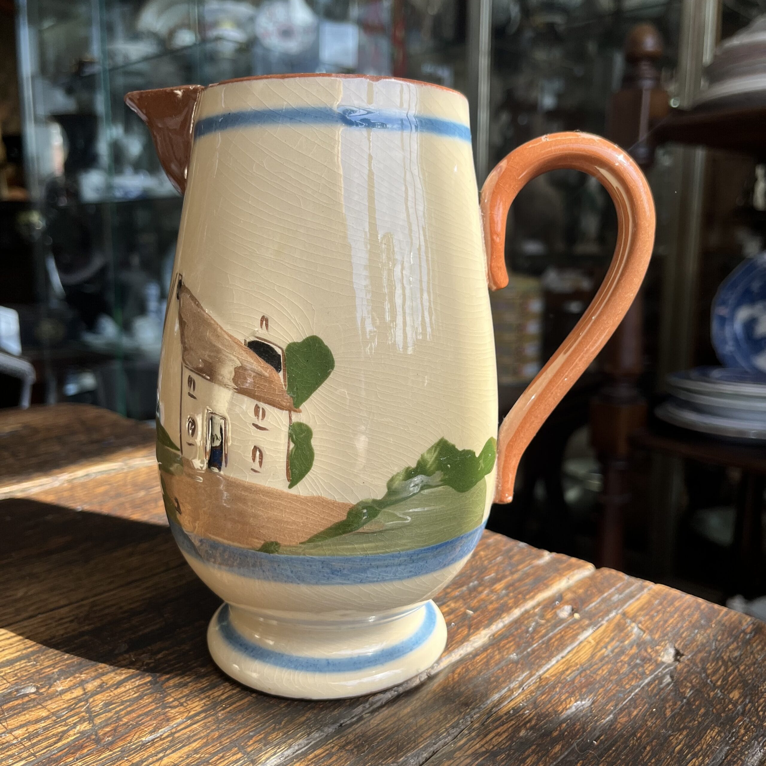 Torquay Pottery Cottageware jug 'Empty Vessels make the most noise', 1920's