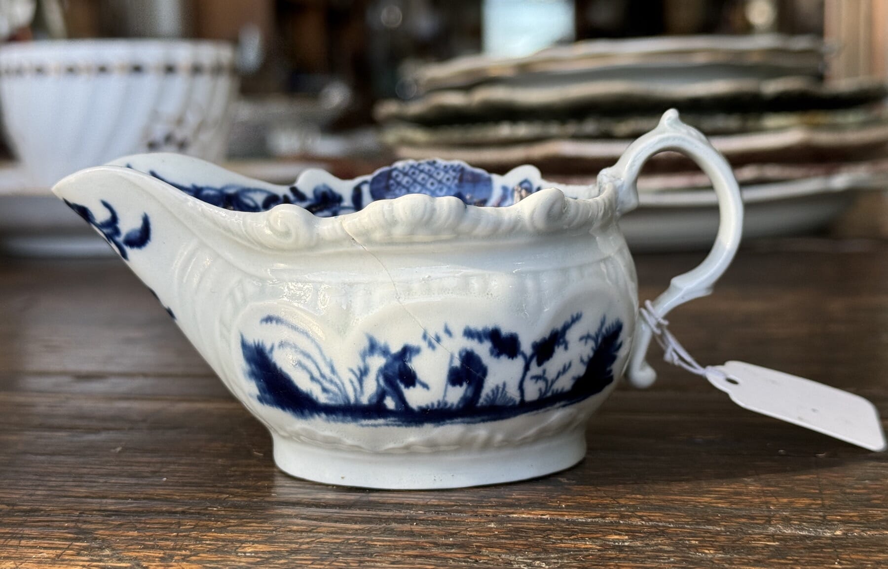 Small Dr Wall Worcester 'Two Porter Landscape' sauceboat, c. 1770