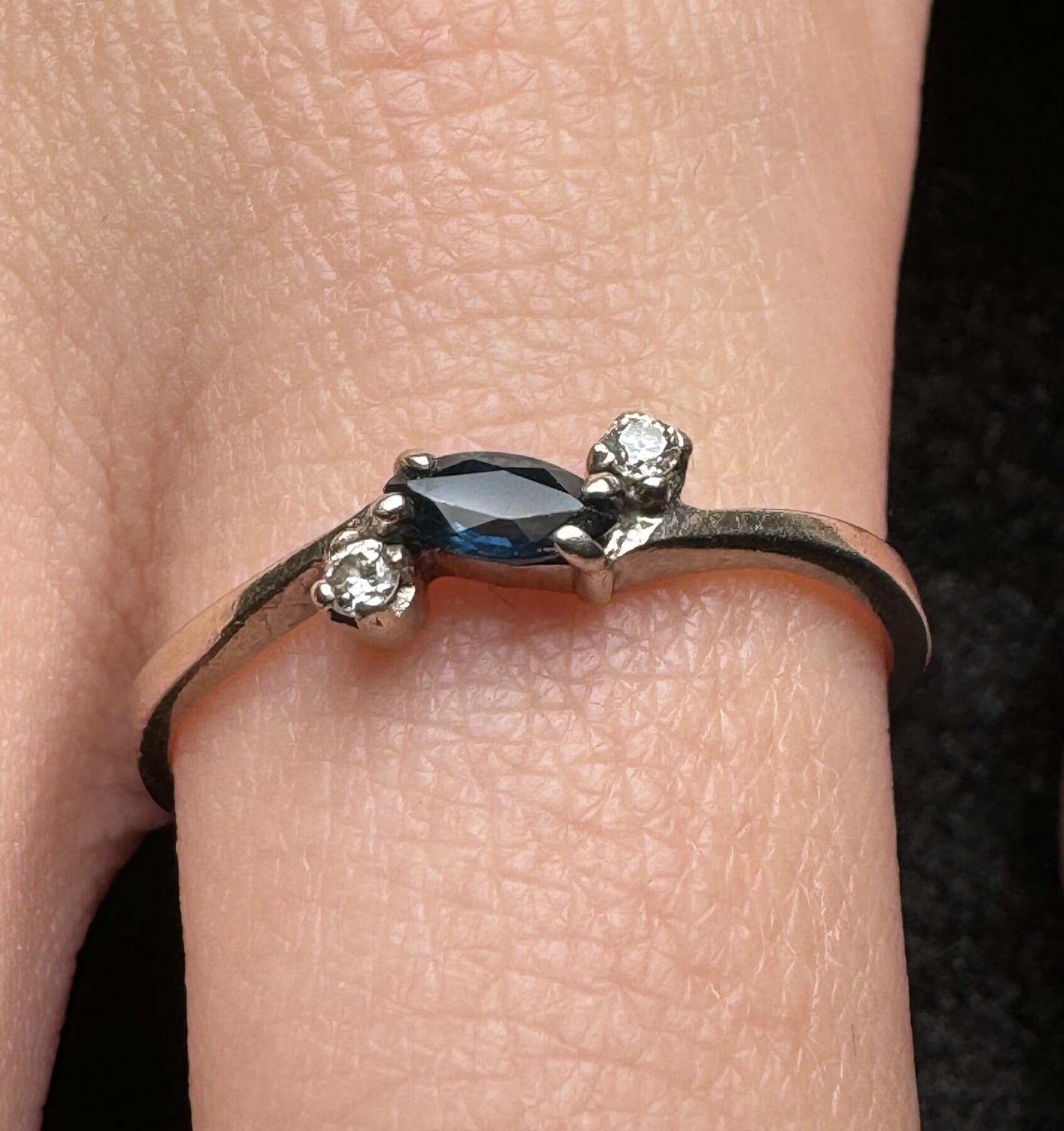 White Gold ‘Trilogy’ ring with deep blue sapphire & two diamonds