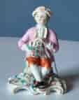 Derby figure of 'Summer', seated boy with wheat, earliest version c. 1760