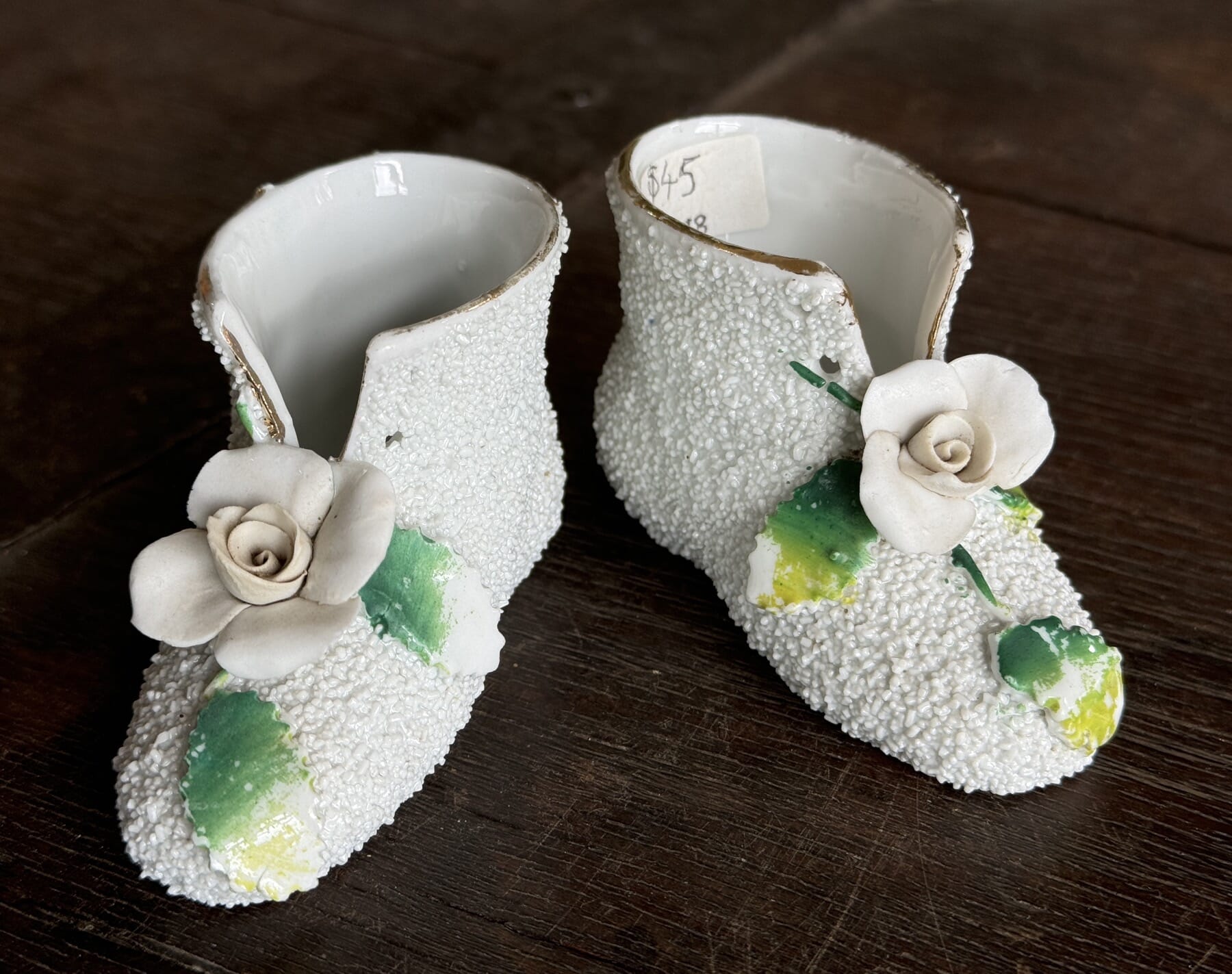 Pair of porcelain 'booties', applied flowers, c. 1900